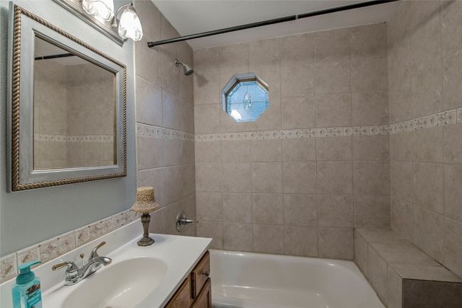Bathroom with vanity and tub / shower combination | Image 20