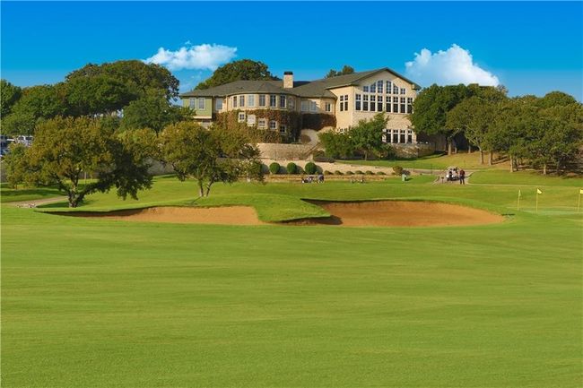 View of property's community club house with view of golf course | Image 30