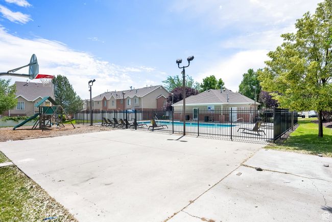View of sport court with a community pool and a residential view | Image 34