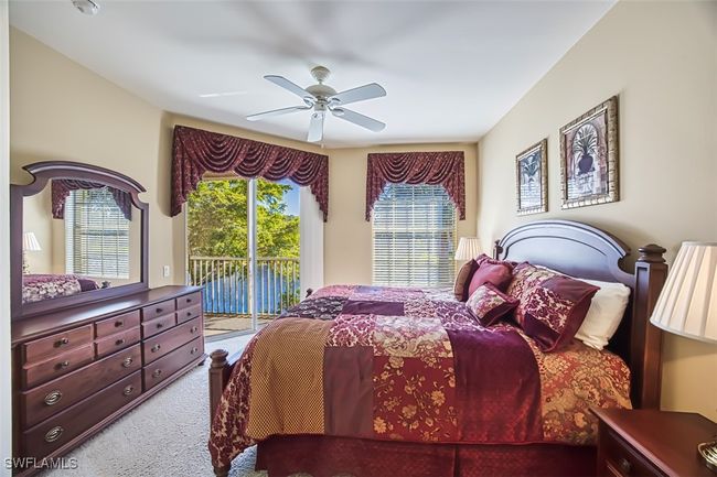 Carpeted bedroom with access to outside and ceiling fan | Image 28