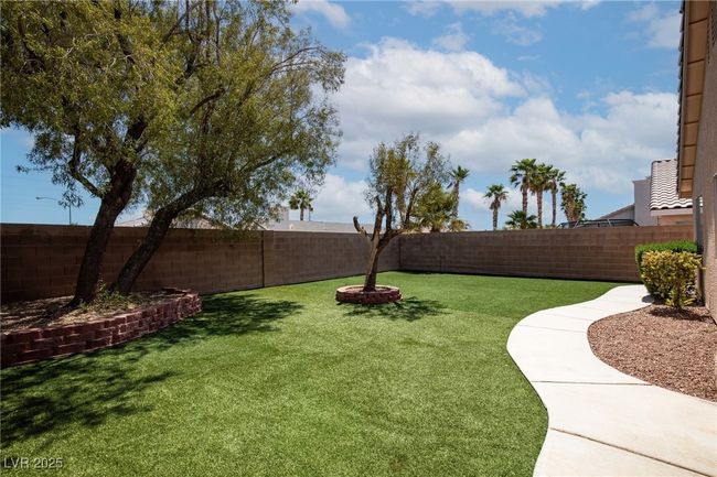 View of yard featuring a fenced backyard | Image 31