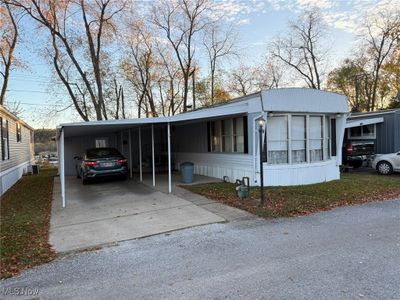 Manufactured / mobile home with a carport | Image 1