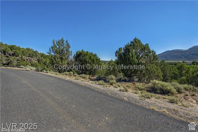 View of asphalt street with a mountain view | Image 4