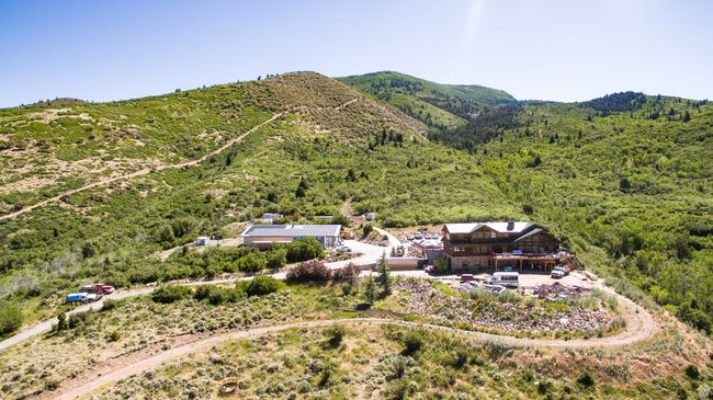 Drone / aerial view featuring a view of trees and a mountain view | Image 4