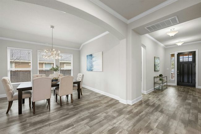 Large windows fill the space with natural light, creating a bright and inviting atmosphere for gatherings. | Image 6