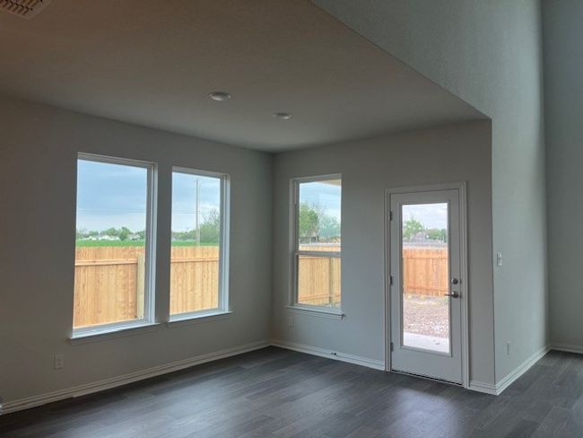 Empty room featuring dark wood-style flooring and baseboards | Image 4
