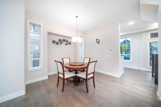 Dining room featuring wood finished floors, baseboards, and recessed lighting | Image 6