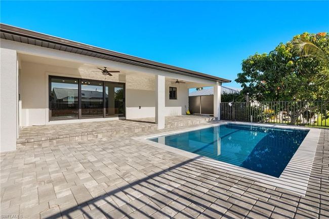 View of pool featuring ceiling fan and a patio area | Image 5