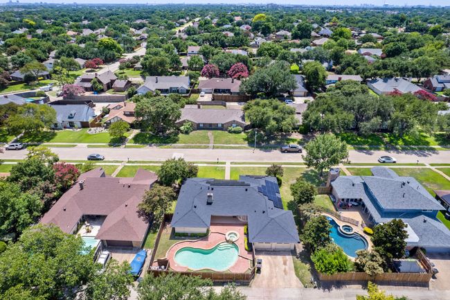 Aerial view of residential area featuring a pool area | Image 32