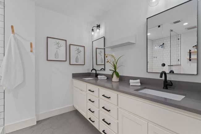 This fabulous ensuite features quartz counter tops and dual vanities. | Image 14
