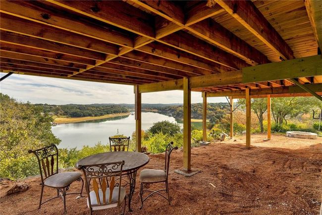 View of patio / terrace with a water view | Image 21