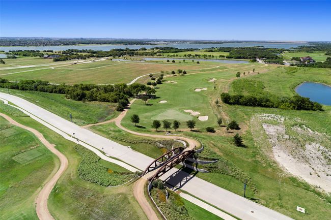 Neighborhood bridges, ponds & parks are a great meet up. The Tribute is also home to miles of lighted jogging paths, ponds, nature bridges, shoreline trails, large and small dog parks & Kayak/Canoe launch pads. There is no shortage of things to get you outside and enjoying nature. Did we mention pickleball? | Image 40