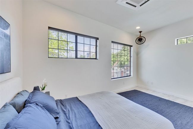 Bedroom featuring recessed lighting and wood finished floors | Image 12