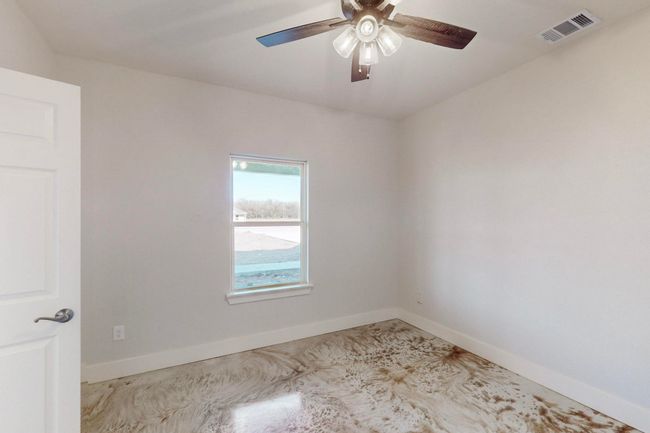 Spare room featuring visible vents, ceiling fan, and baseboards | Image 35