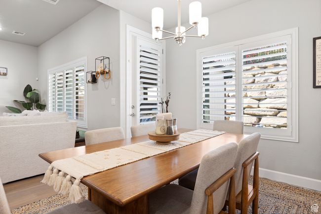 Dining room featuring a chandelier and light wood-type flooring | Image 37