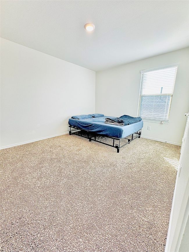 Bedroom featuring carpet flooring and baseboards | Image 16