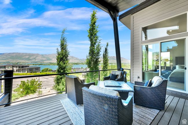 Deck featuring a water and mountain view | Image 81