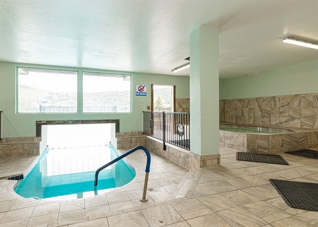 Indoor pool with an in-ground hot tub | Image 22