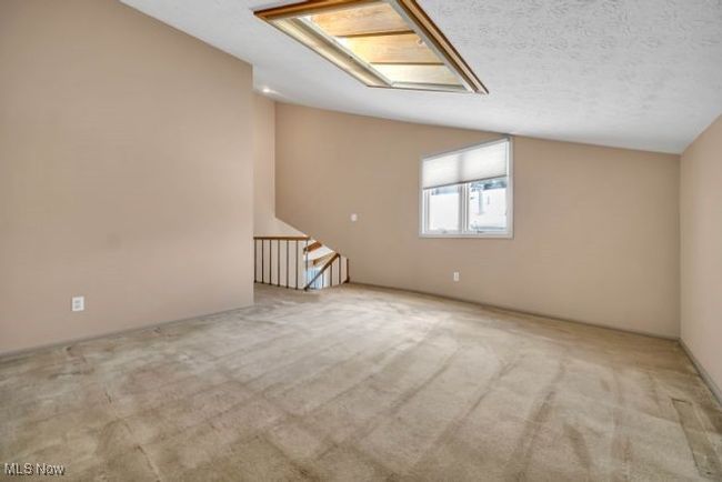 Loft area with multiple purpose can be office/den/study.. Vaulted ceiling and skylight | Image 31