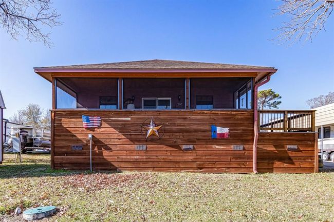 looking upon the rear of the house where the screened in porch is | Image 28