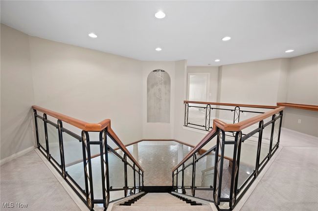 Staircase featuring recessed lighting, carpet flooring, and arched walkways | Image 20