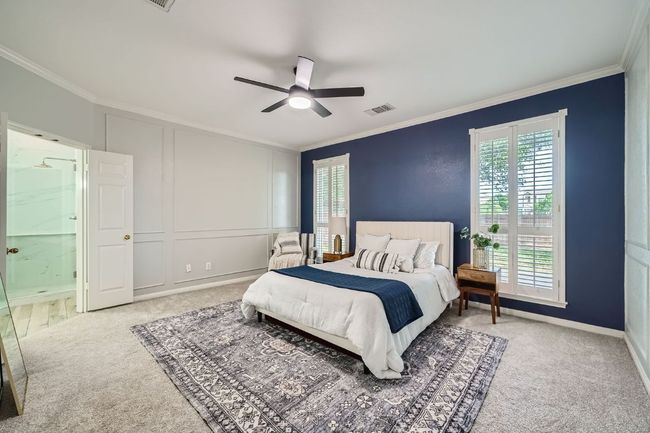Primary suite tucked into its own alcove on the main floor | Image 17