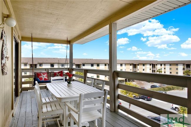 Spacious Balcony with Swing & Storage Closet with View of Pool, Lighthouse & Ocean | Image 31