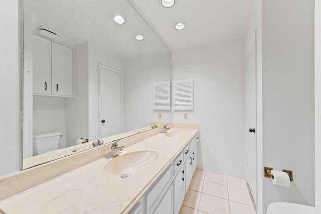 Upstairs bathroom featuring a spacious dual-sink vanity, ample storage, and modern lighting. Perfect for comfort and convenience. | Image 20