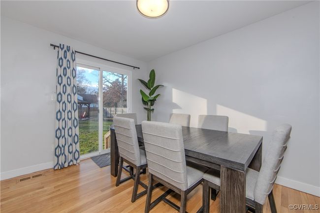 Dining room featuring light wood-type flooring | Image 14