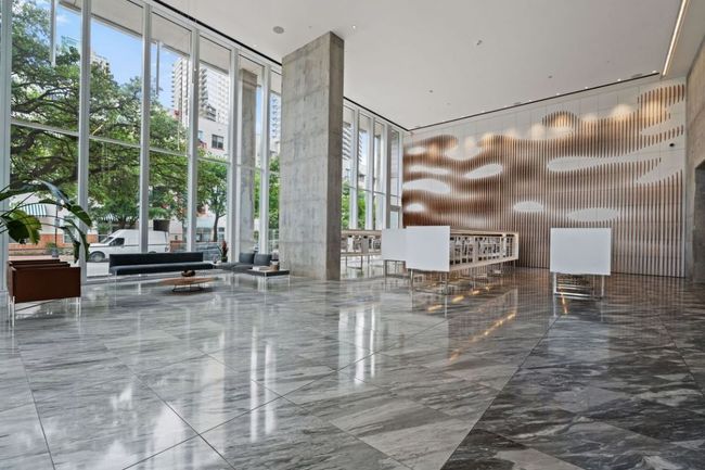 Community lobby with a towering ceiling and expansive windows | Image 31