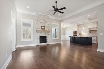 Living Room Fireplace framed by Windows | Image 2