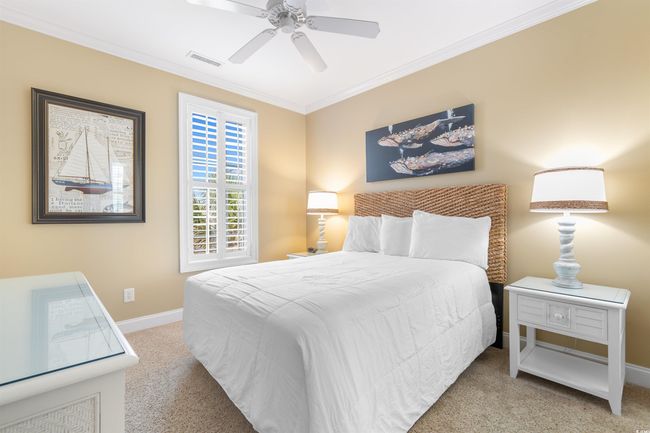 Bedroom featuring crown molding, and ceiling fan | Image 37