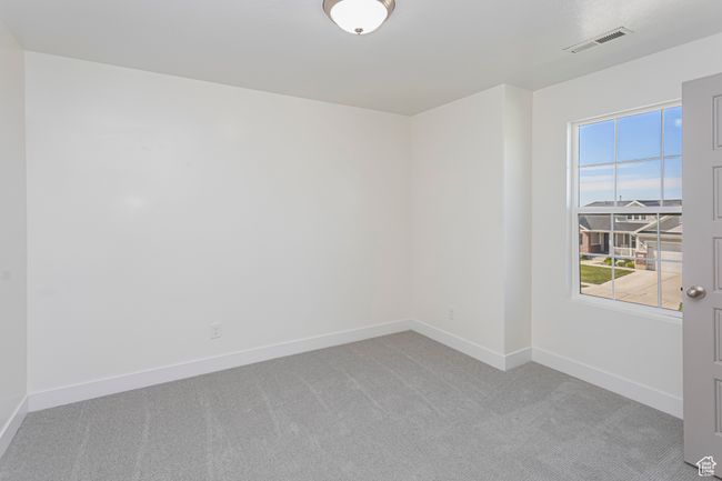 Empty room with baseboards, visible vents, and carpet | Image 24