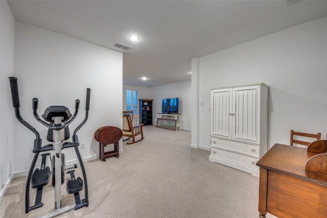 Exercise area featuring visible vents, baseboards, recessed lighting, and carpet floors | Image 23