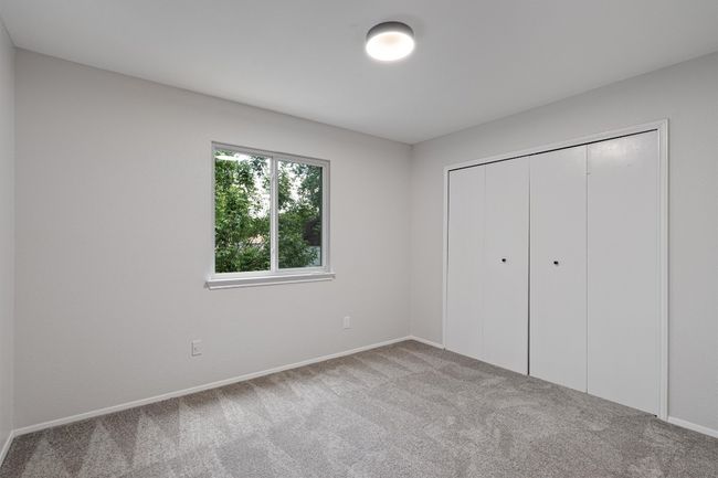 Unfurnished bedroom featuring carpet floors and a closet | Image 16