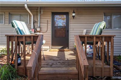 Doorway to property with a deck | Image 2