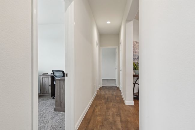 Hall with wood finished floors, baseboards, and recessed lighting | Image 17