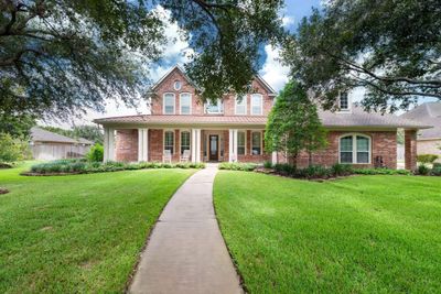 Come discover a stunning 4/4/3 David Weekley Home located in Grayson Lakes on a large lot (0.671 acres) with an inviting pool. | Image 1