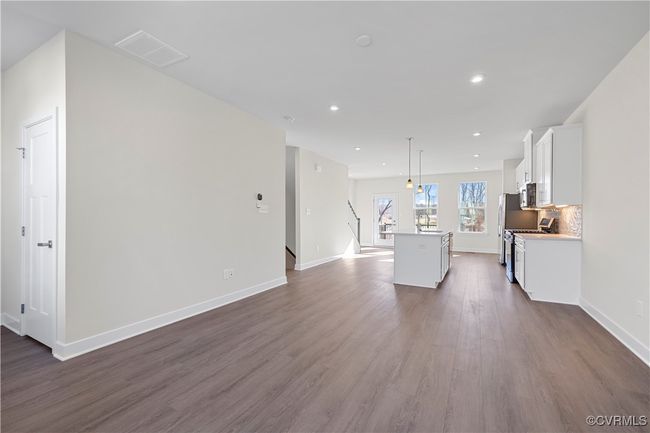 Living room featuring recessed lighting, baseboards, dark wood finished floors, and visible vents | Image 7