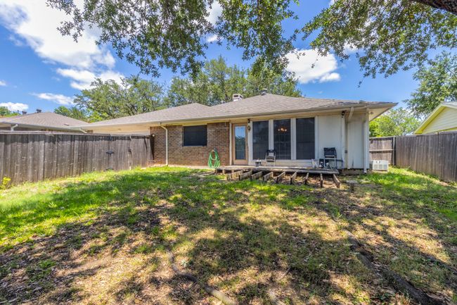 Back of house with brick siding and a cooling unit | Image 24