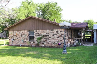 View of side of home featuring a yard | Image 2