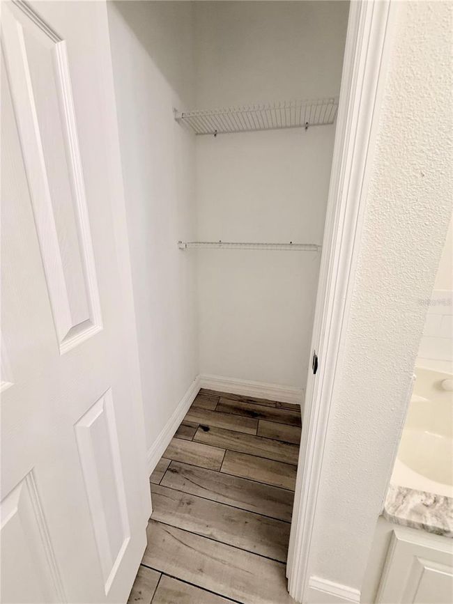 primary linen closet in primary bath | Image 18