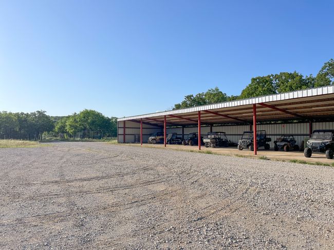 View of car parking featuring an outbuilding | Image 6