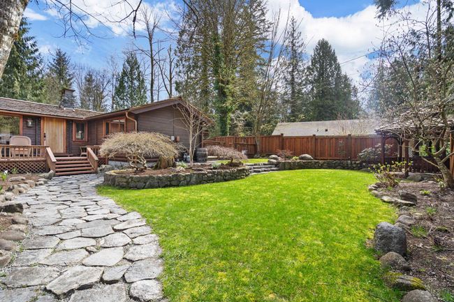 View of yard with a deck | Image 37