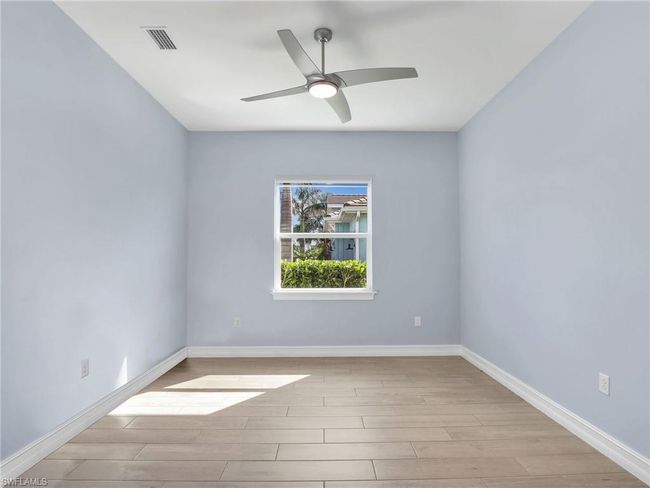 Spare room with light wood-type flooring and ceiling fan | Image 27