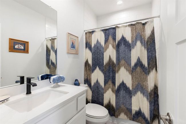 Stylish and bright upstairs bathroom featuring modern fixtures. | Image 38