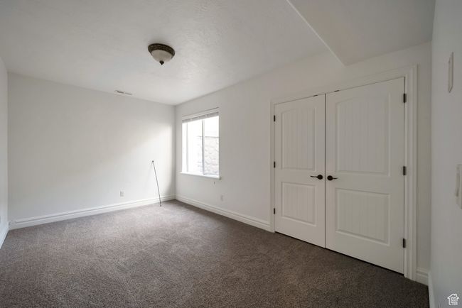 Unfurnished bedroom with a closet, visible vents, carpet floors, and baseboards | Image 29