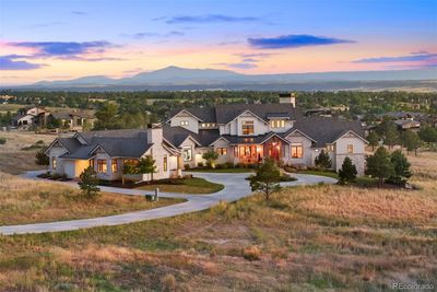 Architecturally exquisite, custom home on over four acres in Colorado Golf Club. | Image 1