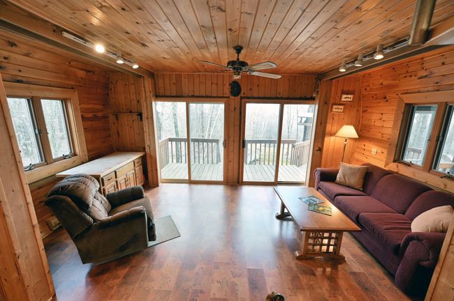 The guest house has charming plank walls and practical vinyl floors. | Image 72