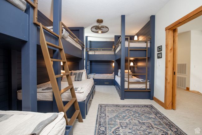 Bedroom featuring light carpet, baseboards, and visible vents | Image 16